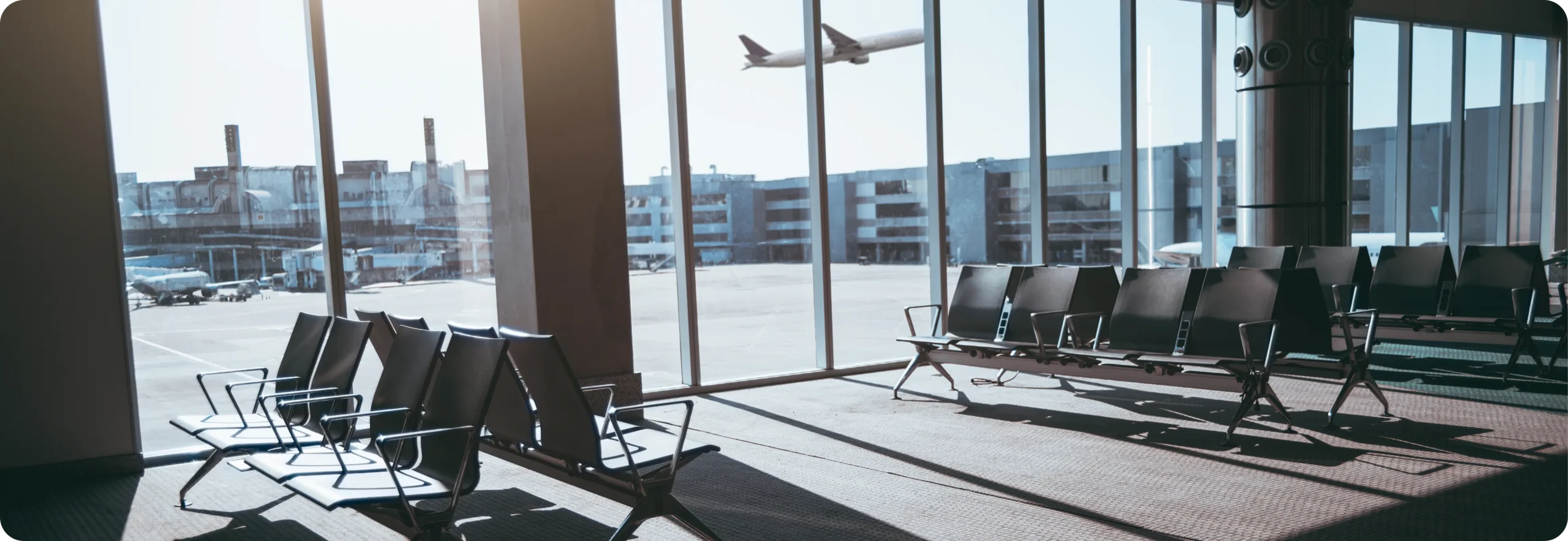 Passenger seating area at airport gate in clean terminal