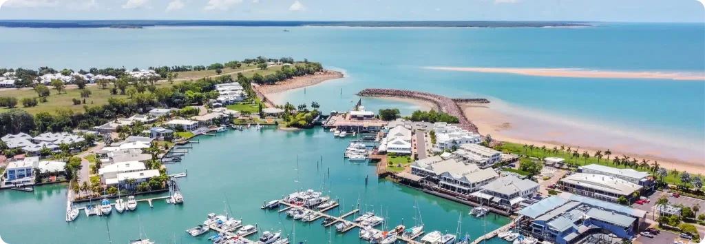 Northern Territory marina with boats and surrounding buildings