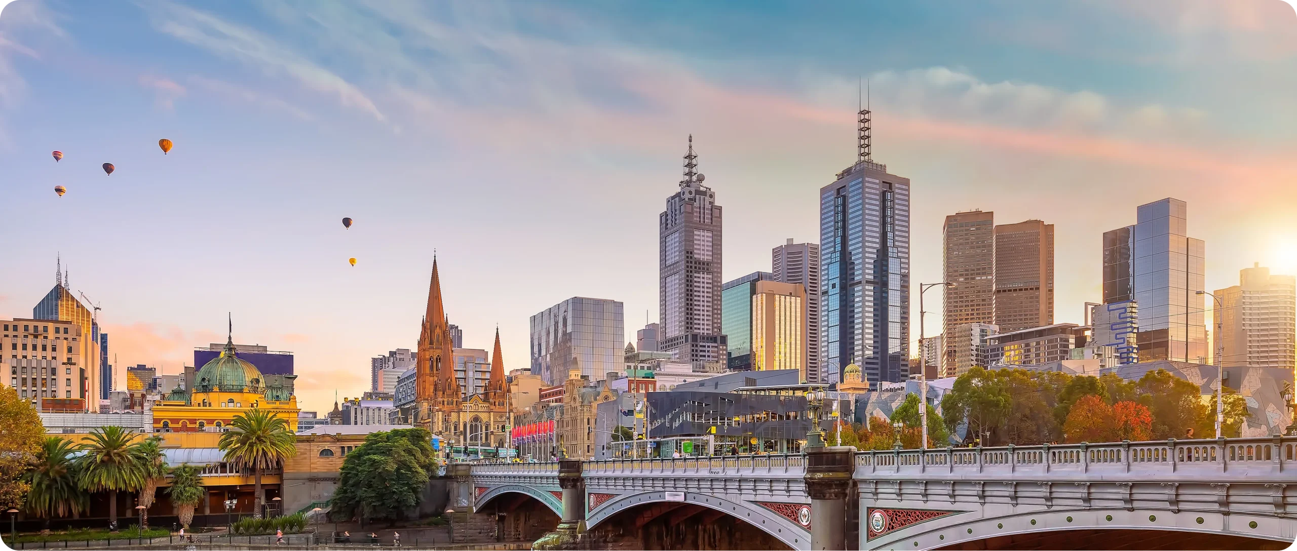 Victoria skyline in evening light with sunset behind buildings