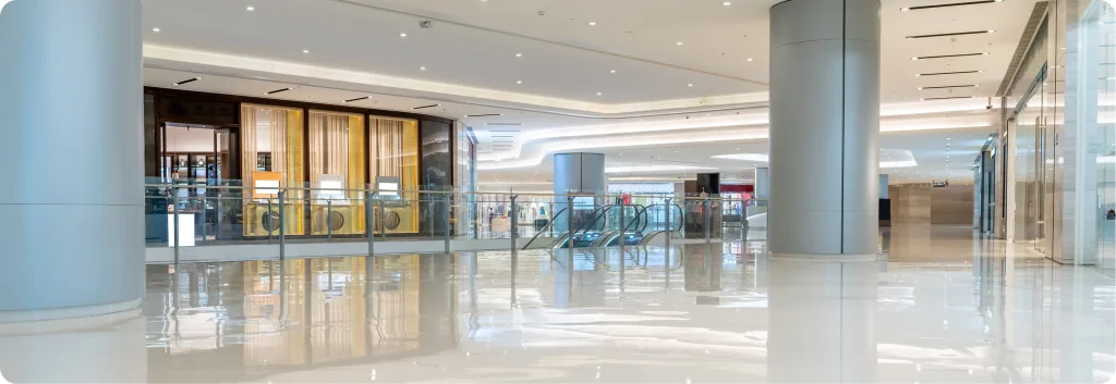 Clean shopping centre interior with polished floors and empty walkways